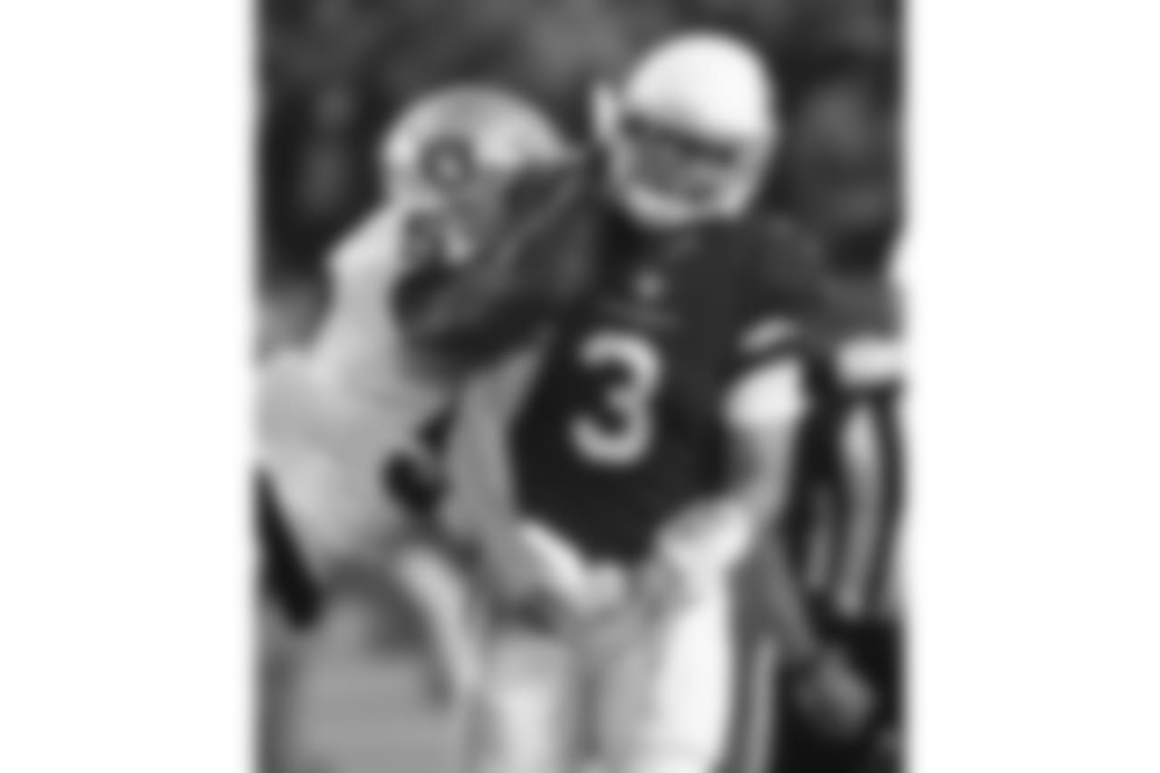 QB Carson Palmer takes a hit