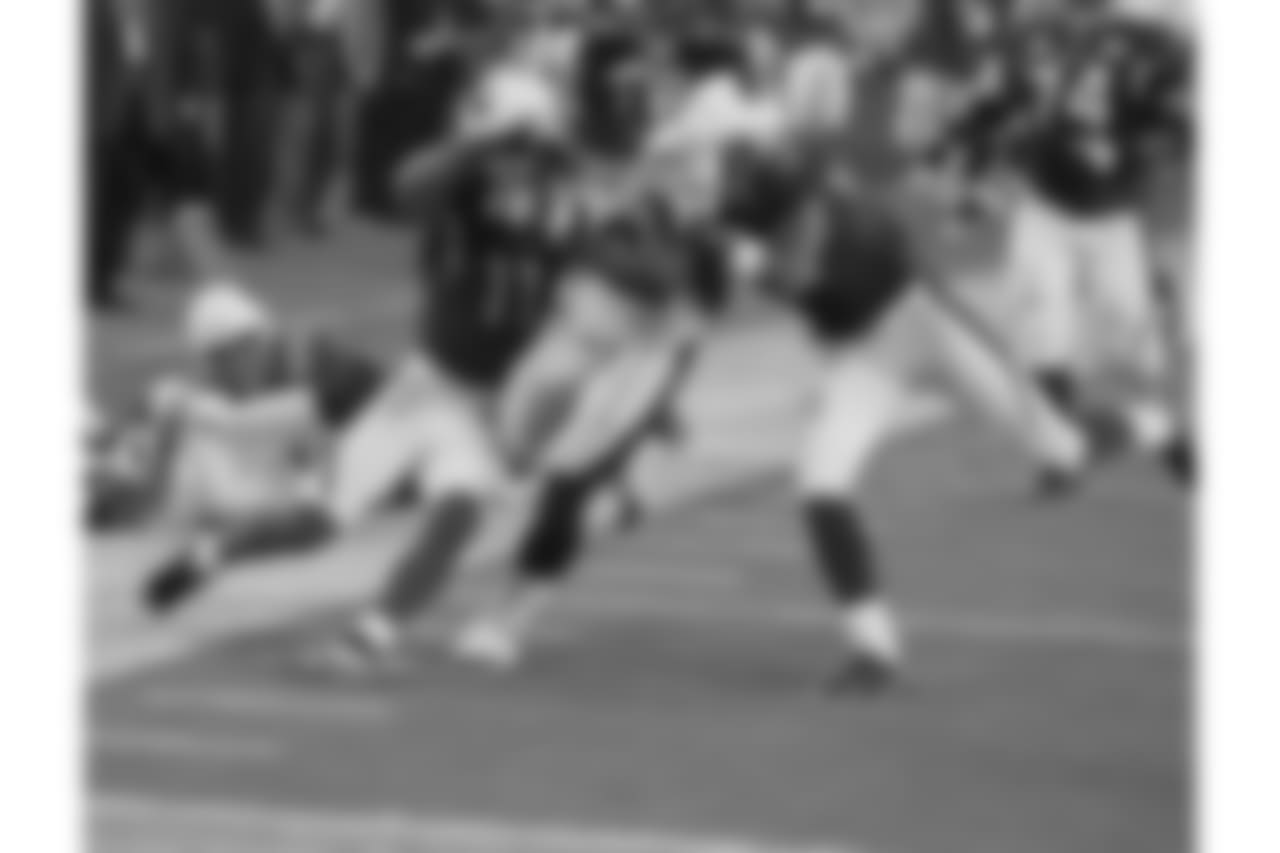 Fitzgerald and Steve Breaston can't pull down Steelers linebacker James Harrison on his 100-yard interception return during the Super Bowl