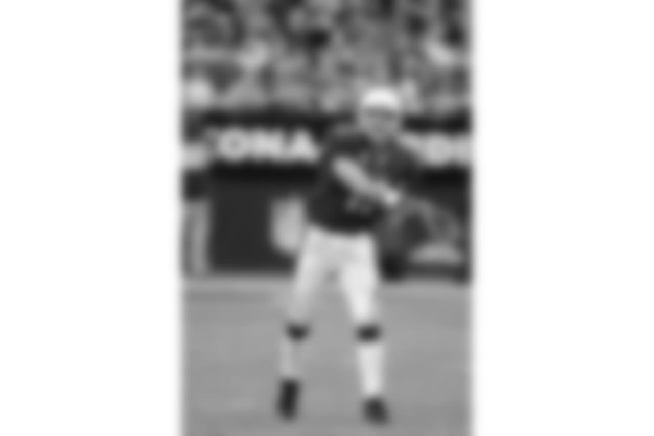 Warner throws a pass