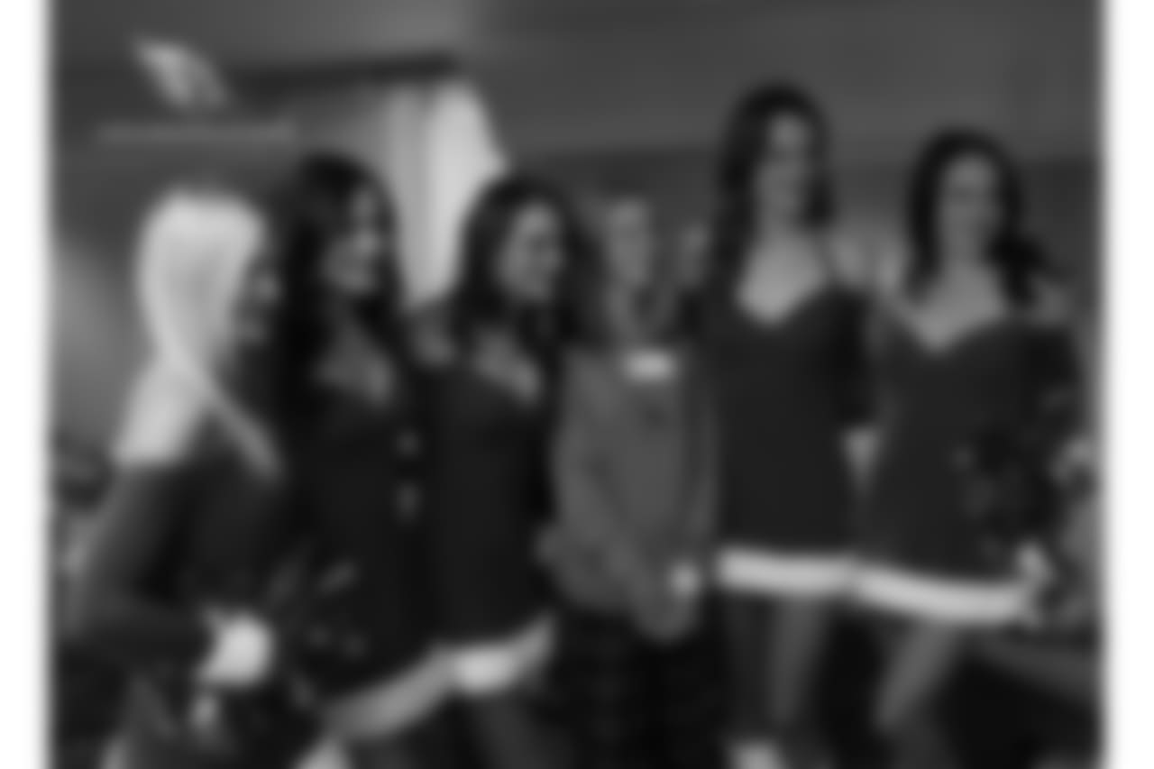 The cheerleaders pose