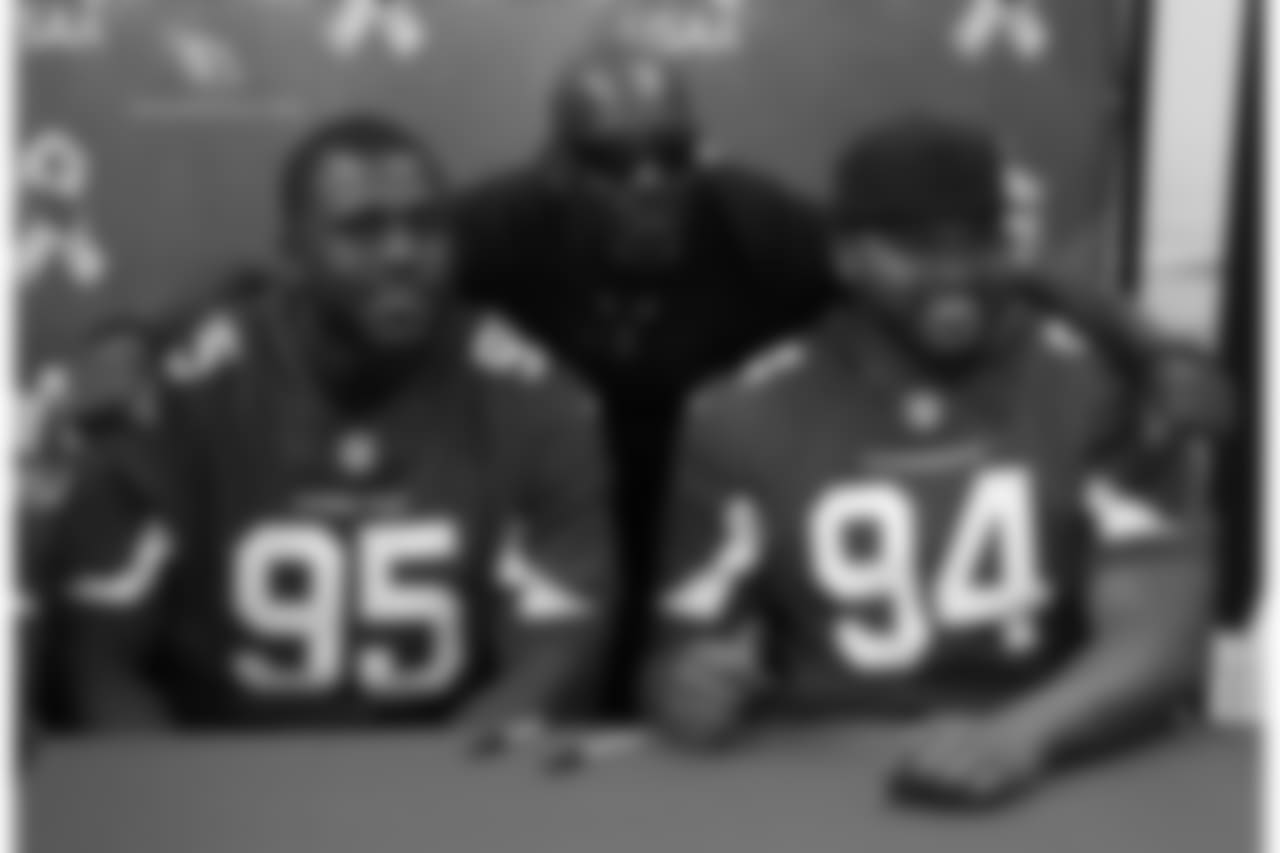 DT Rodney Gunter (left) and DT Xavier Williams pose with a fan