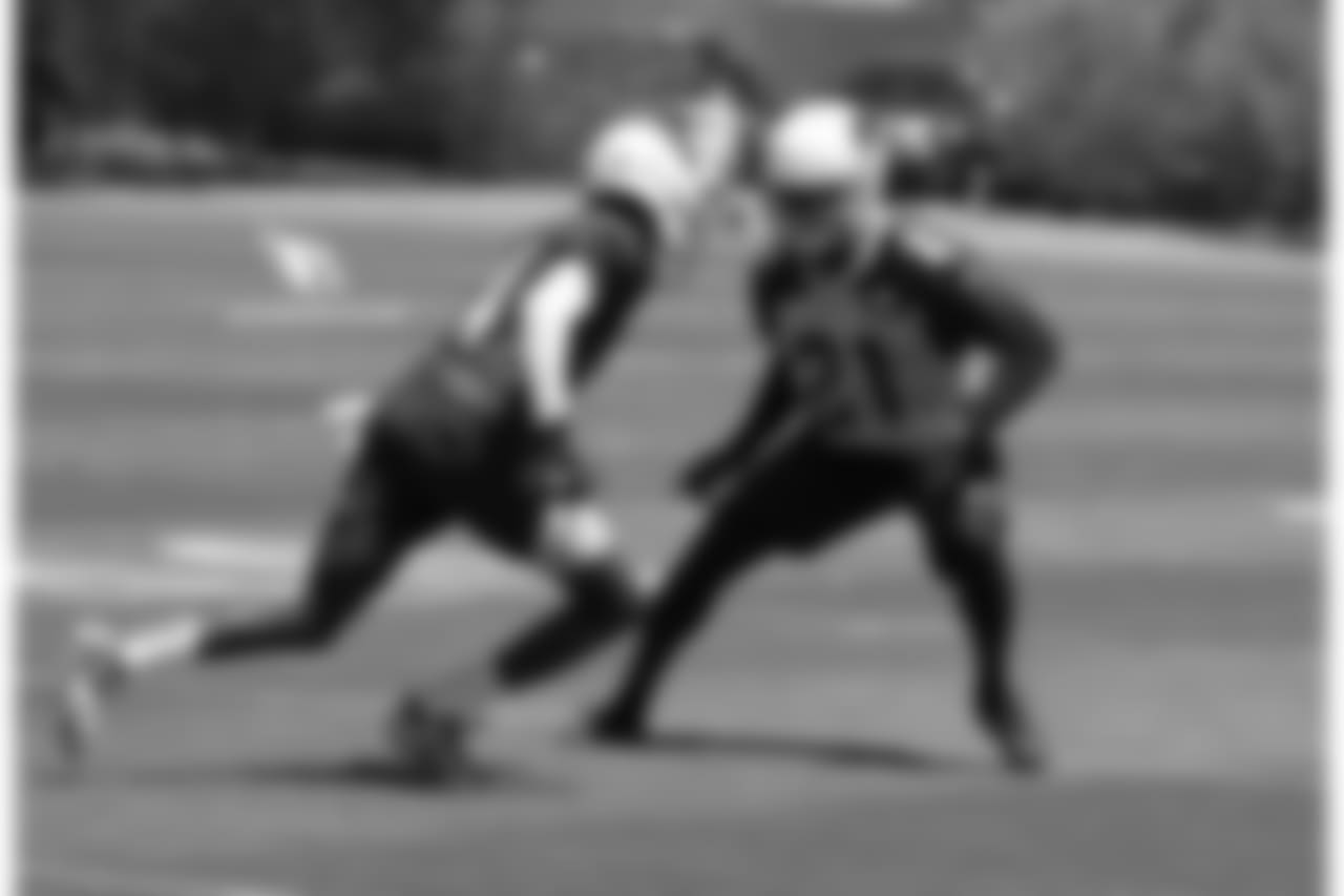 WR J.J. Nelson (left) runs a route against CB Patrick Peterson