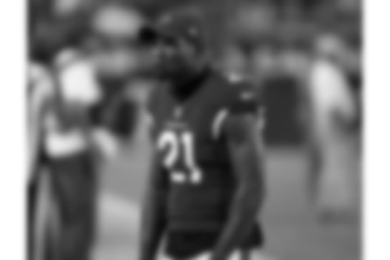 Patrick Peterson takes in game action from the sideline
