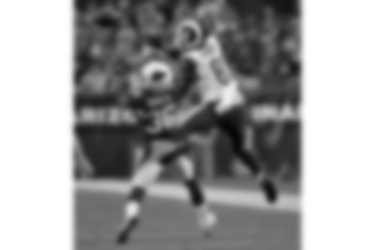 Cardinals S Budda Baker and Rams TE Gerald Everett go up for the ball