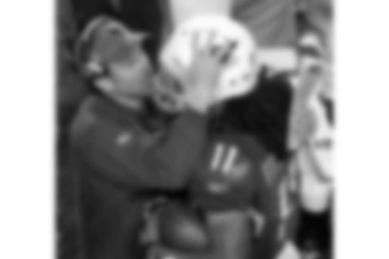 Offensive coordinator Todd Haley celebrates with Fitz after his Super touchdown
