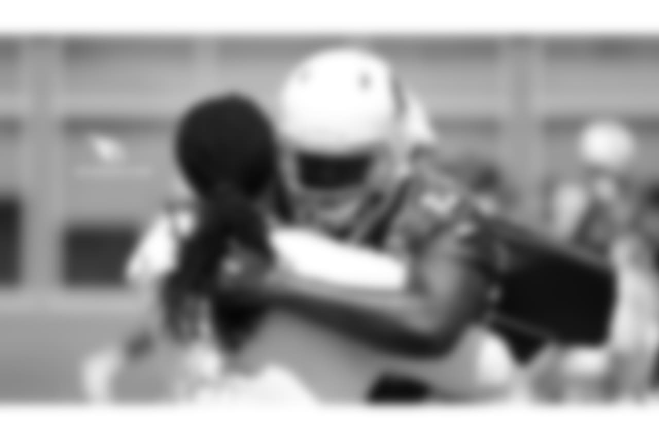 DE Markus Golden (left) and DE Chandler Jones hug it out