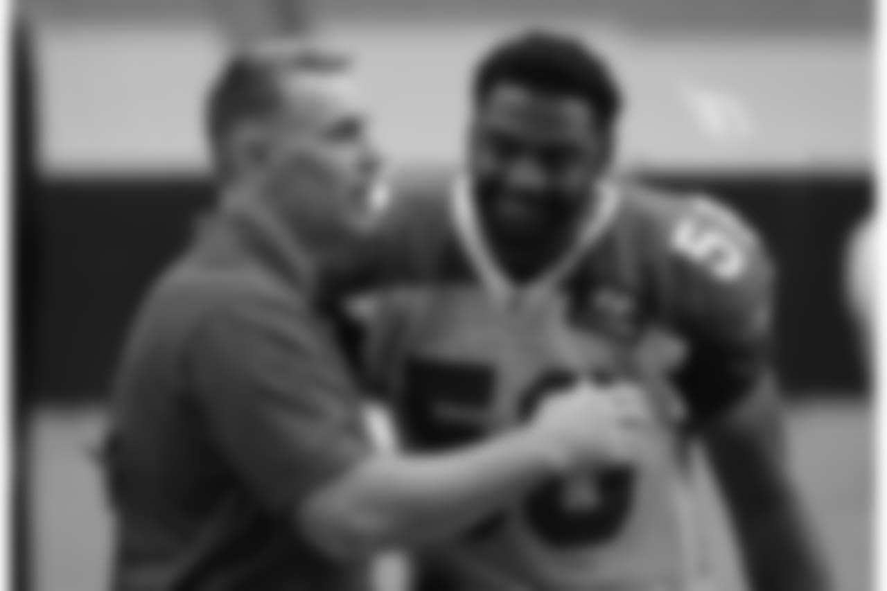 Hall of Famer/NFL Network reporter/former Cardinals quarterback Kurt Warner gets a welcome hug from former teammate Karlos Dansby
