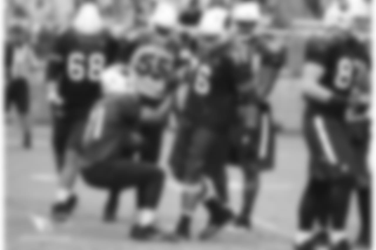 G Mike Iupati helps up RB David Johnson