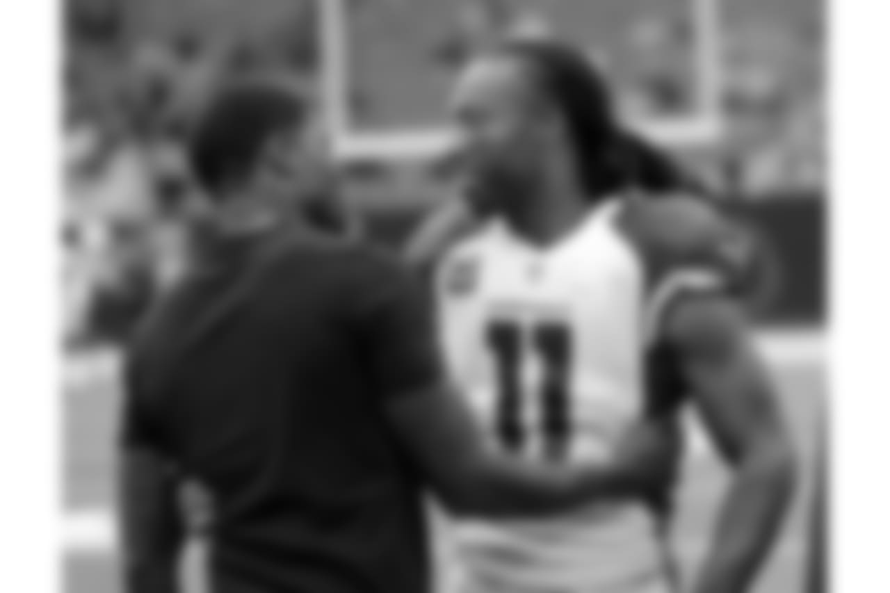 WR Larry Fitzgerald (right) with former Texans star Andre Johnson