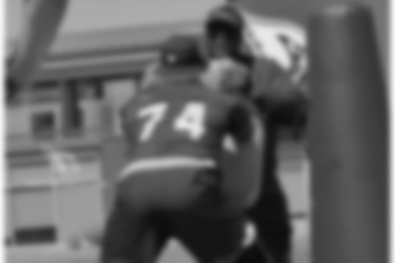 OL coach Ray Brown works with T D.J. Humphries