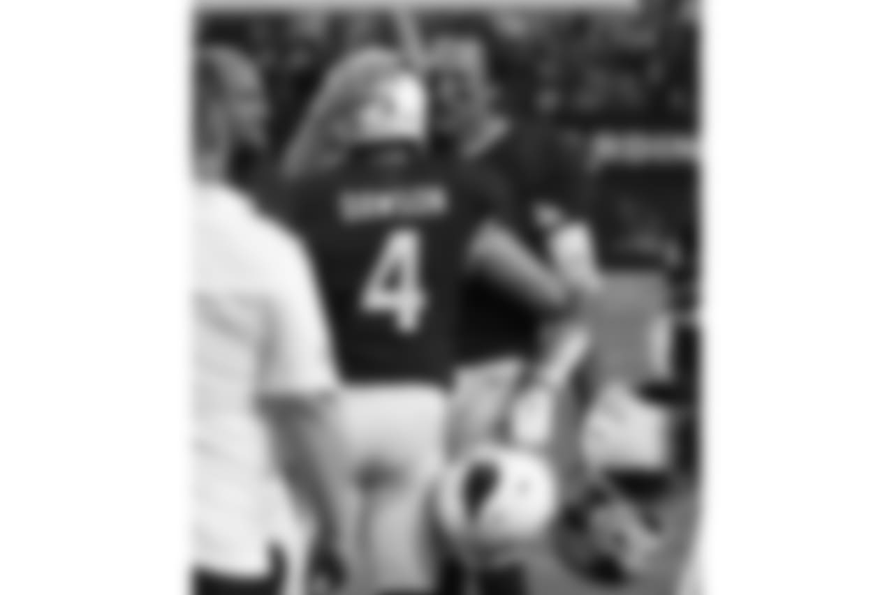 Blaine Gabbert congratulates Phil Dawson after making the field goal