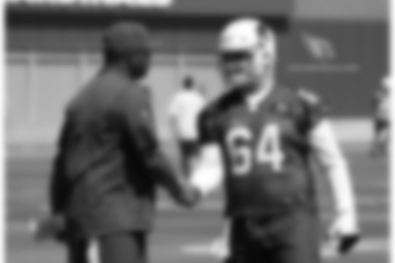C Mason Cole greets QB coach Byron Leftwich
