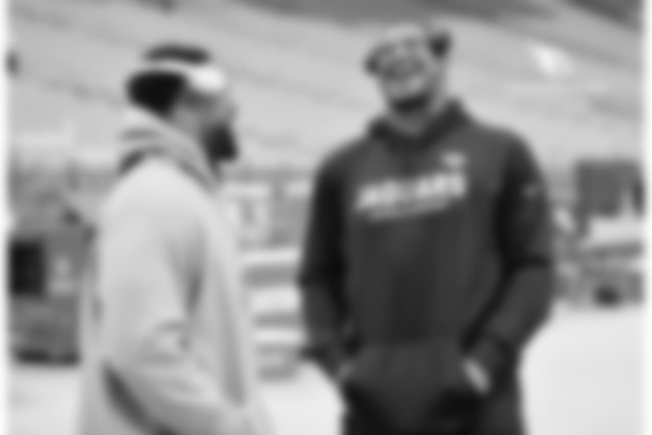 DL Corey Peters (left) catches up with former Cardinal Calais Campbell