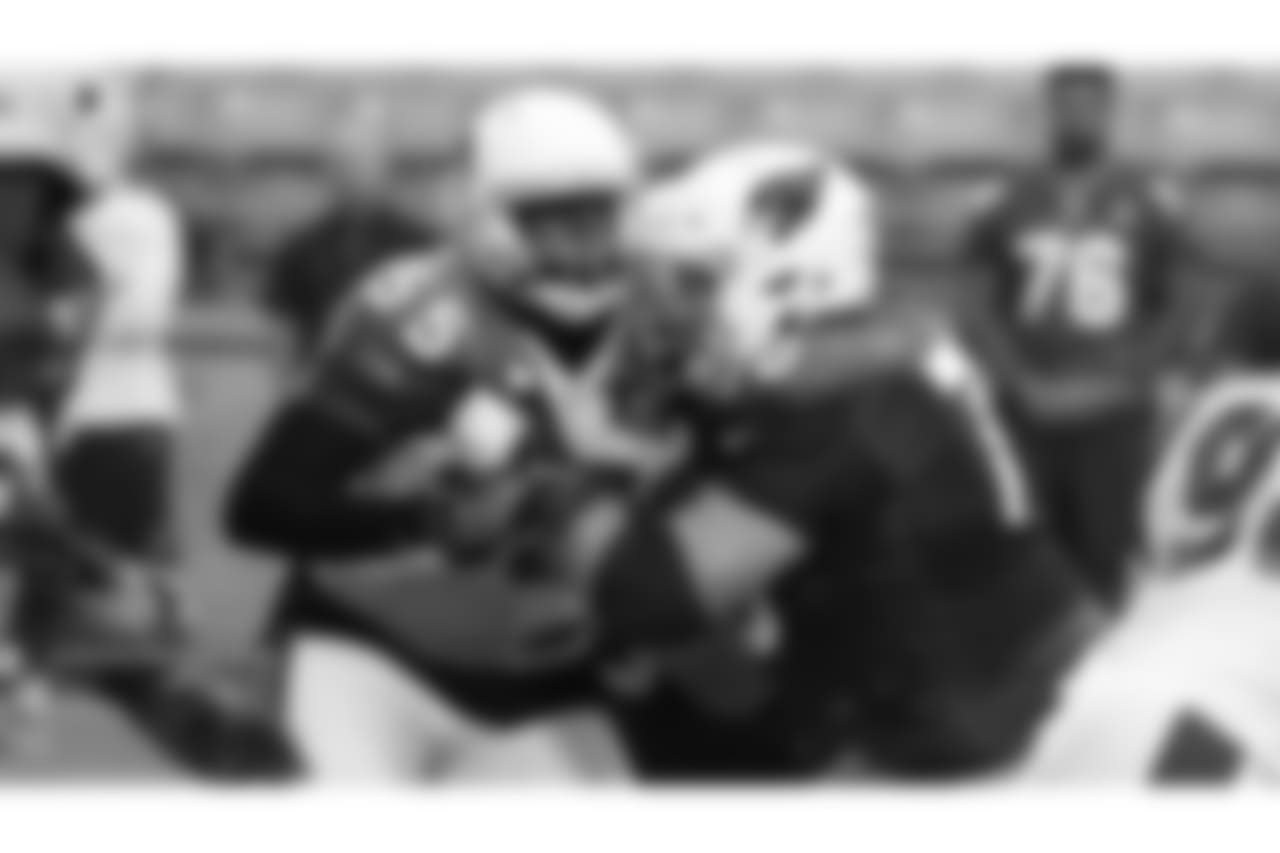 DE Chandler Jones locks up with G Evan Boehm.