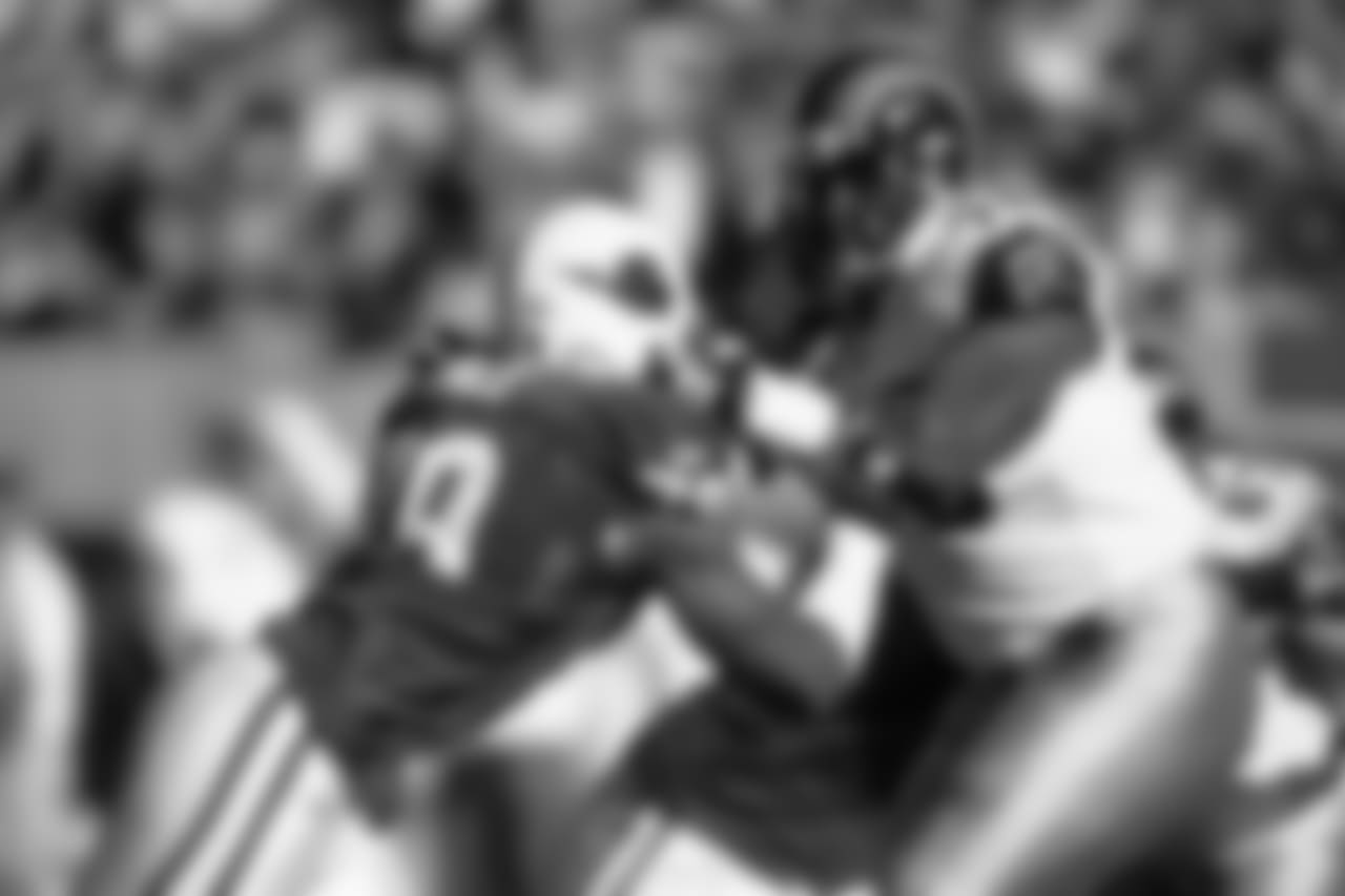 2003: DE Calvin Pace rushes against Rams LT Orlando Pace