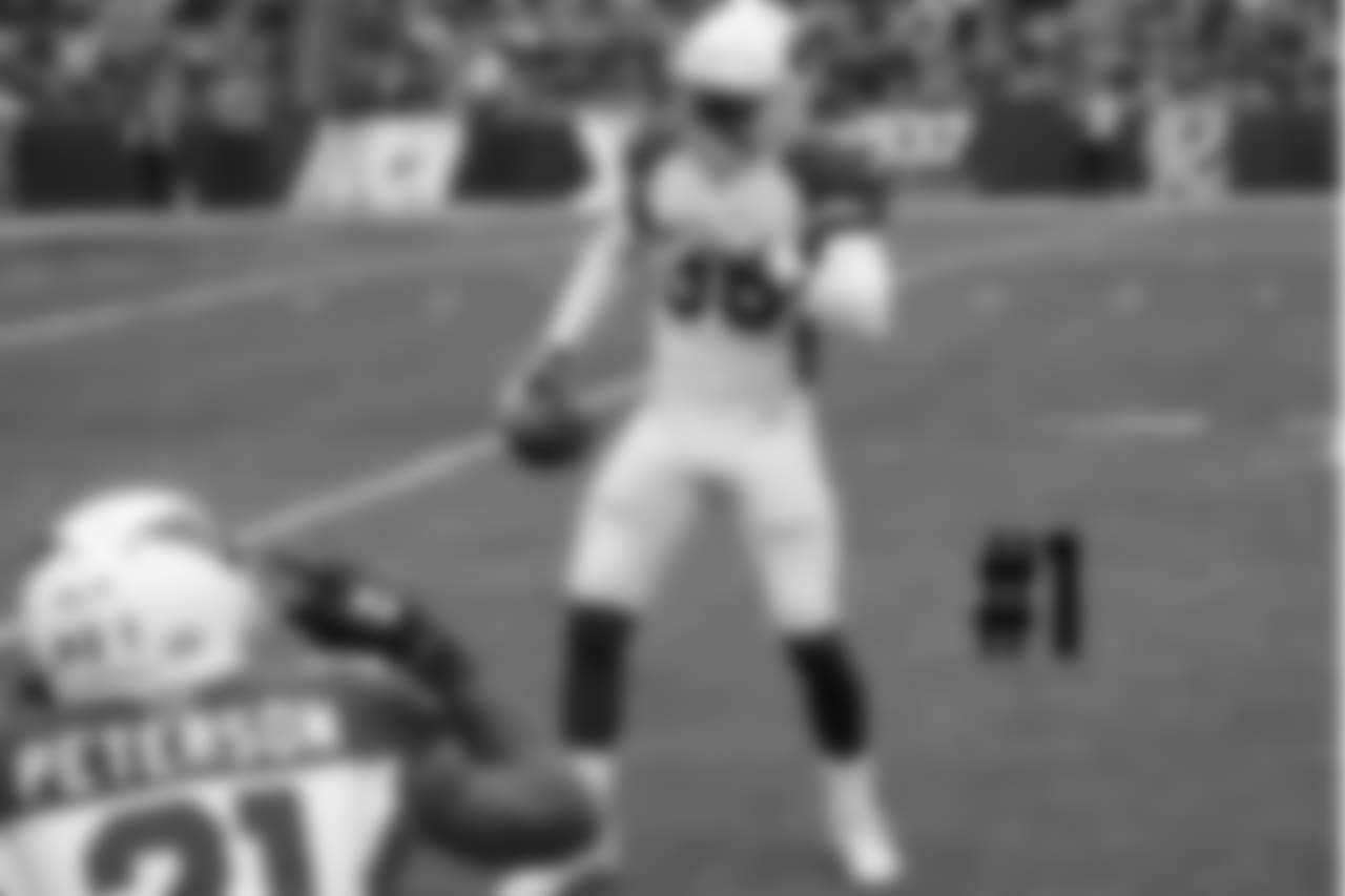 S Budda Baker gets "photographed" by CB Patrick Peterson afetr a fumble recovery