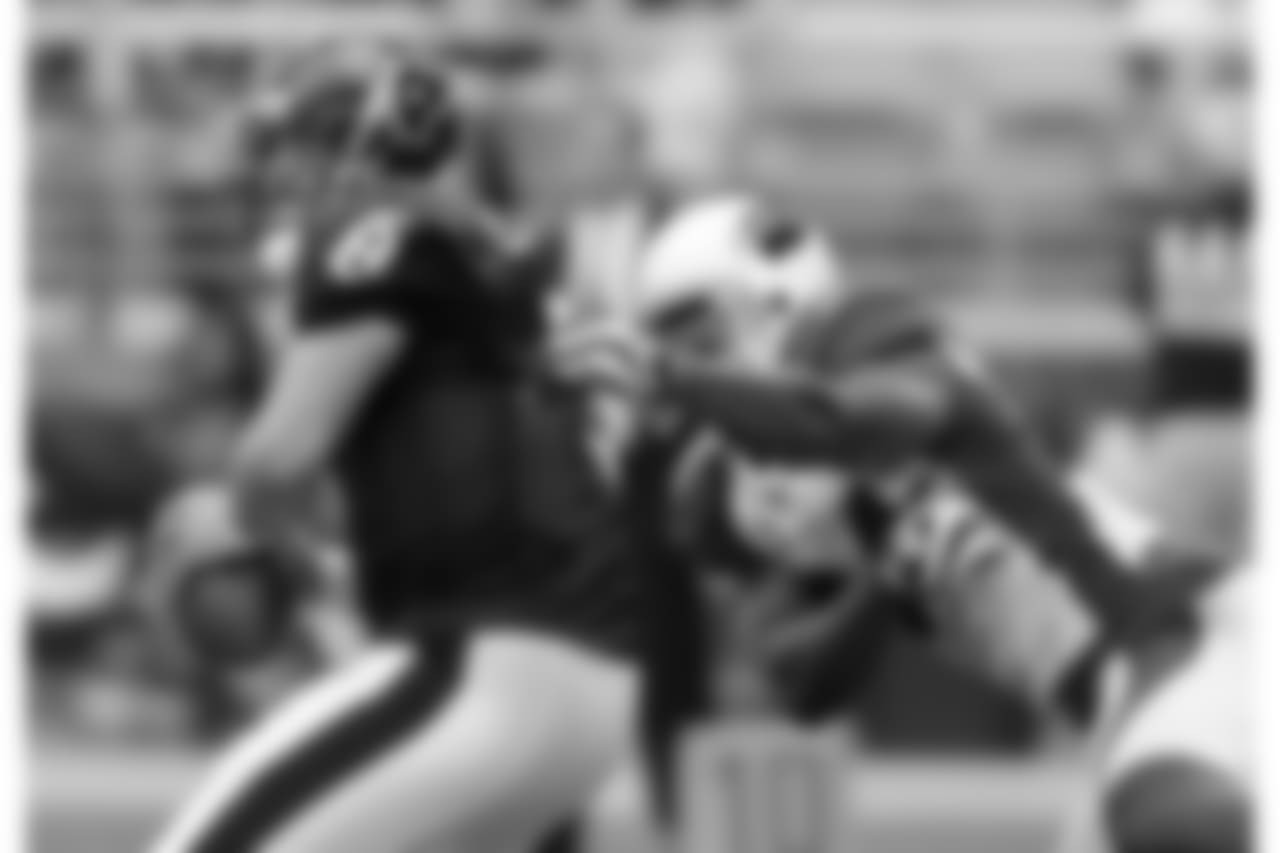 2009: S Adrian Wilson pressures Texans QB Matt Schaub