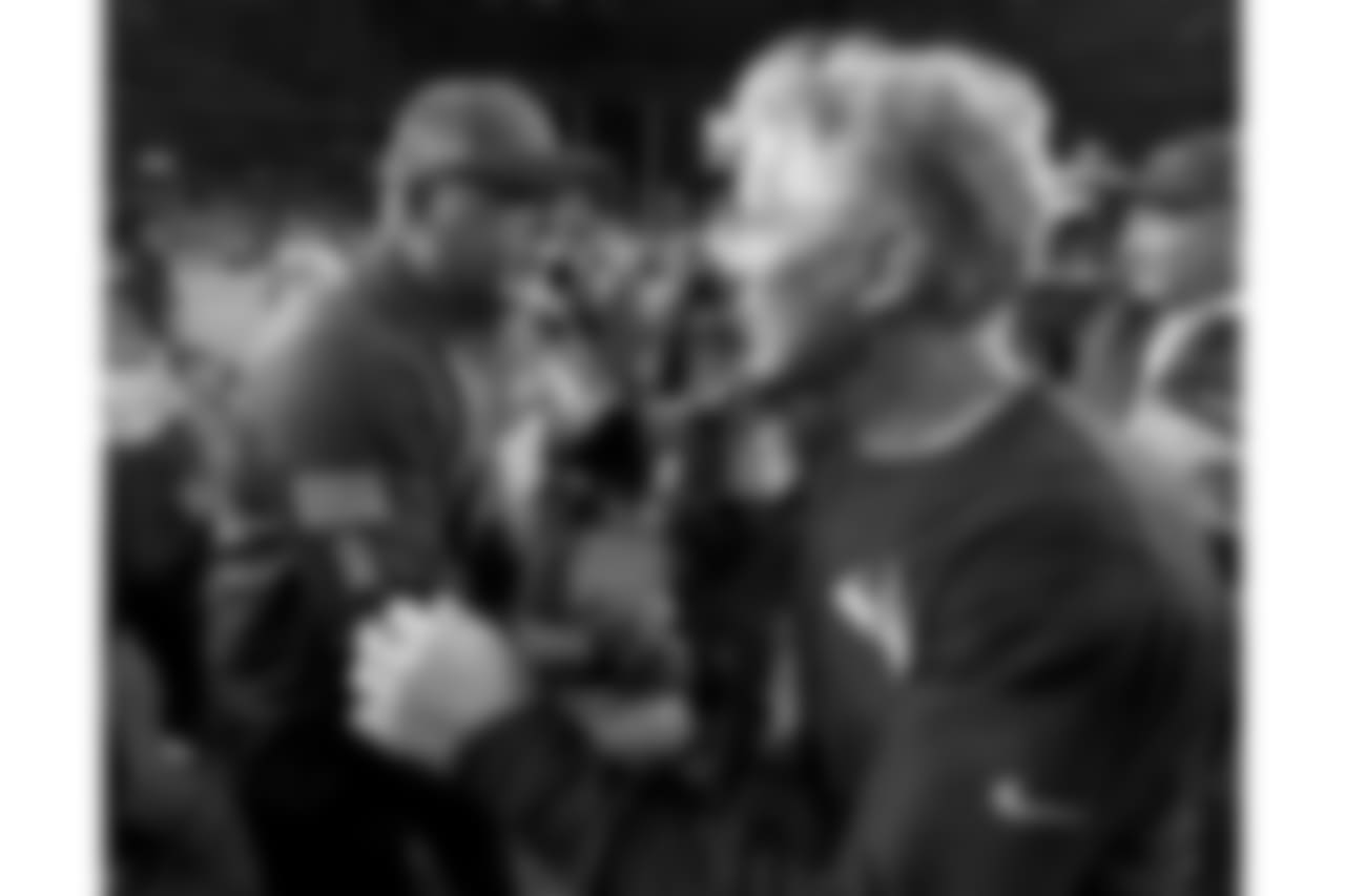 Cardinals head coach Bruce Arians (left) greets Seahawks head coach Pete Carroll (right) after the game