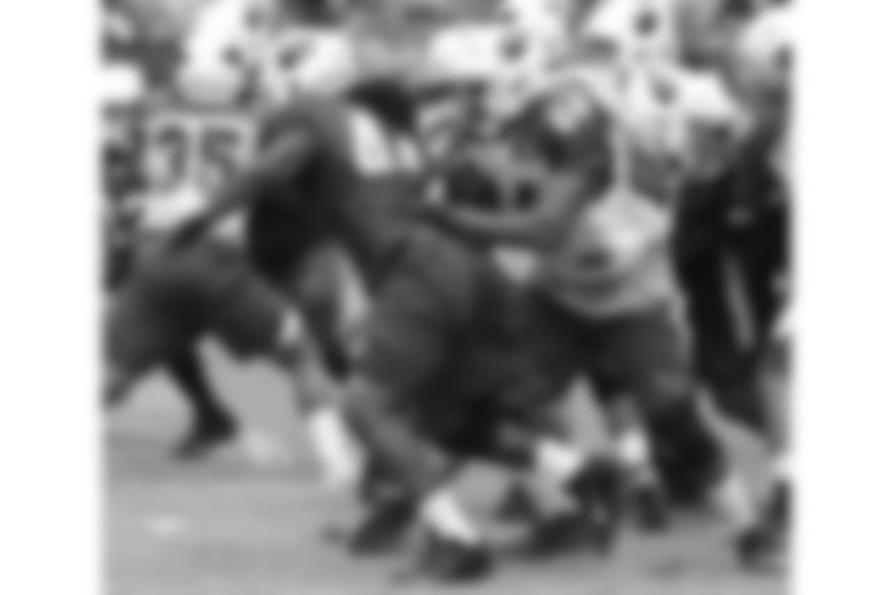 G Dorian Johnson takes on LB Markus Golden