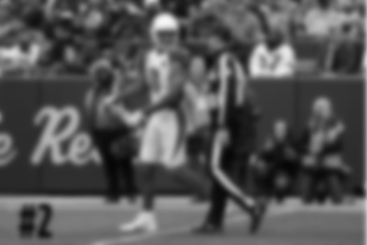 WR Larry Fitzgerald returns a penalty flag to an official