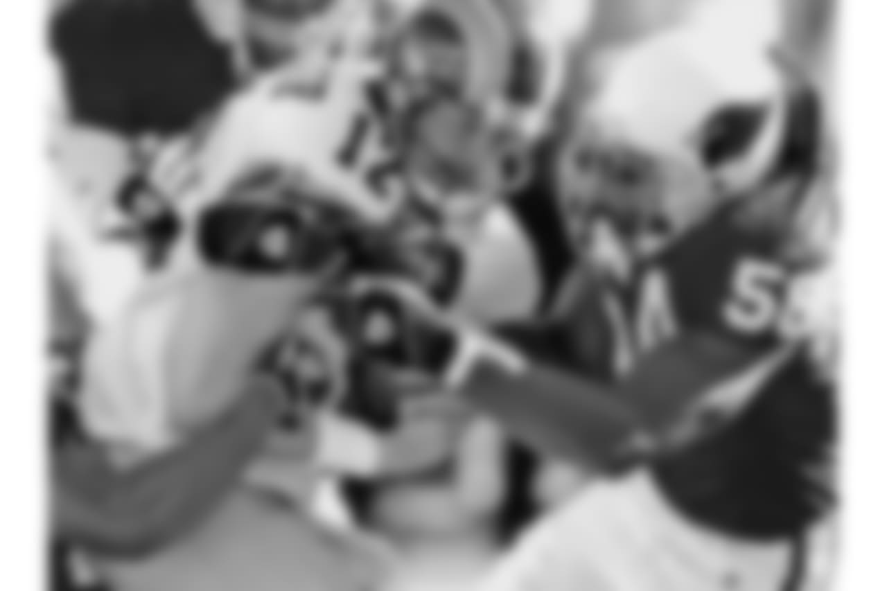 2004: LB Karlos Dansby wraps up Rams QB Chris Chandler