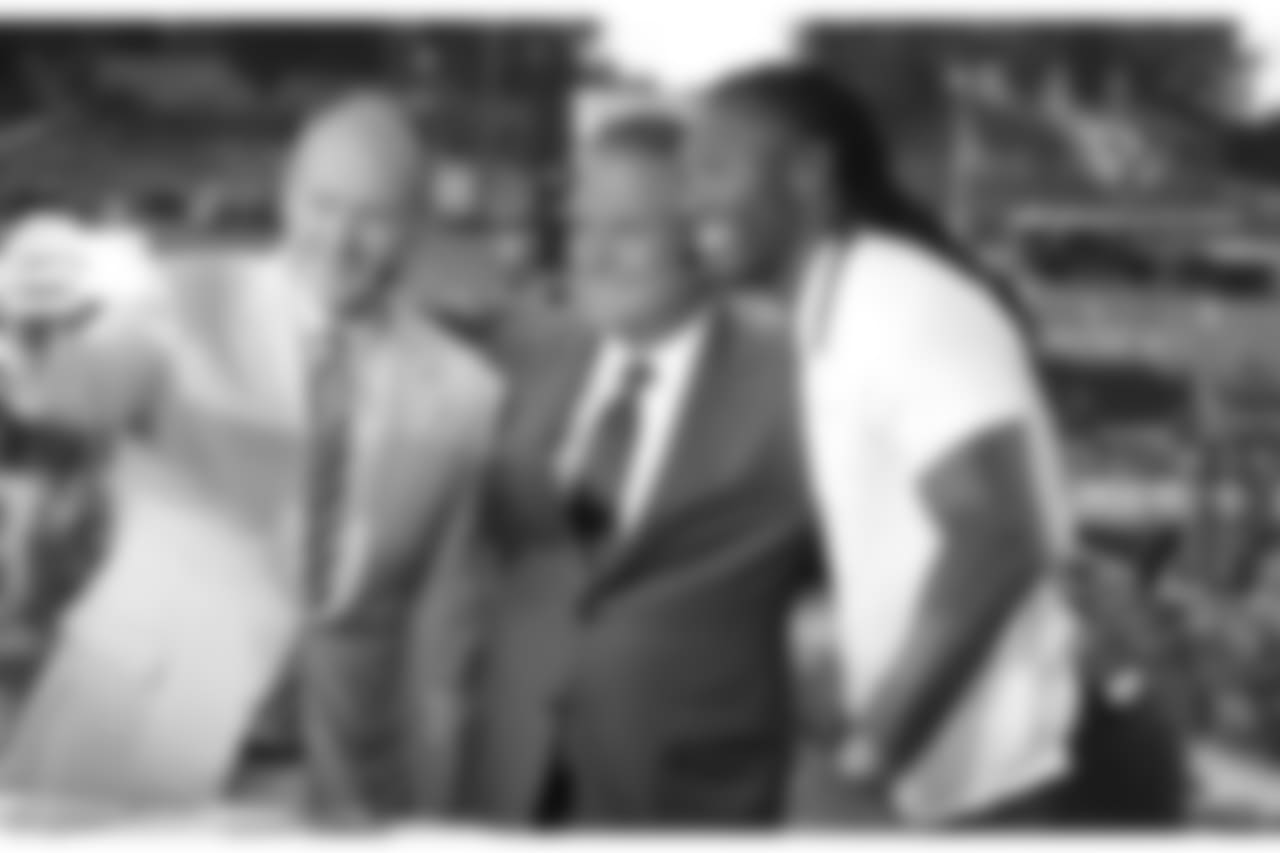 Larry Fitzgerald takes a selfie with Rich Eisen and Steve Mariucci after an NFL Network interview