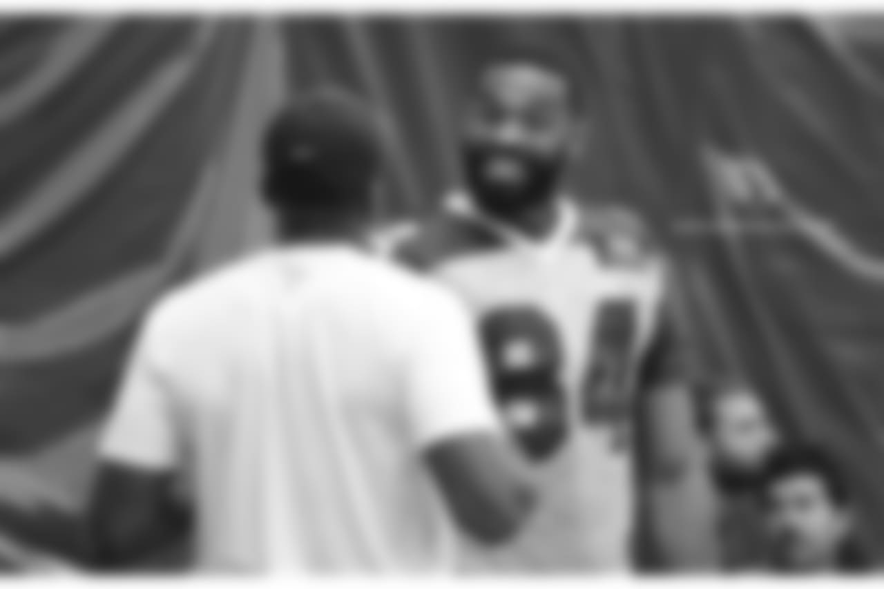 TE Jermaine Gresham talks with assistant strength and conditioning coach Roger Kingdom