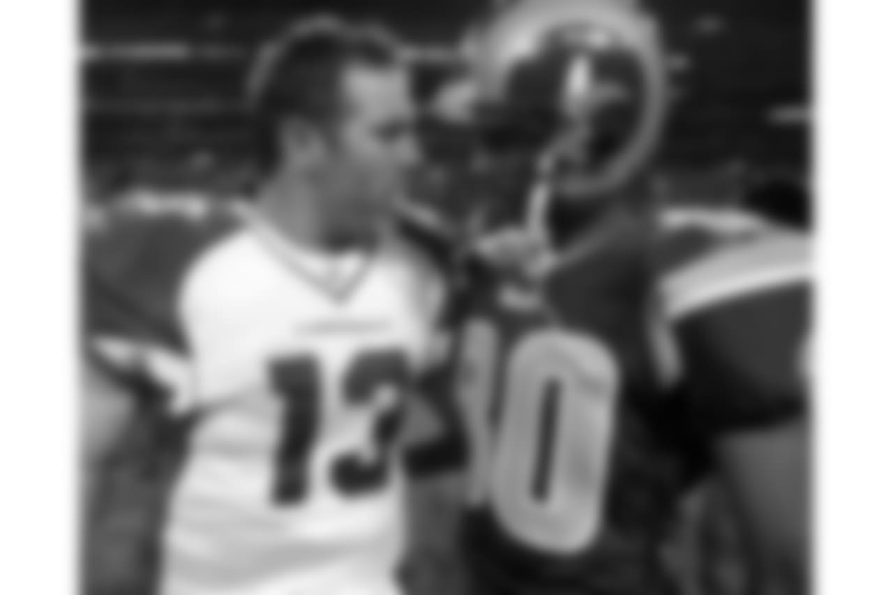 2005: QB Kurt Warner (left) with former teammate, Rams WR Isaac Bruce