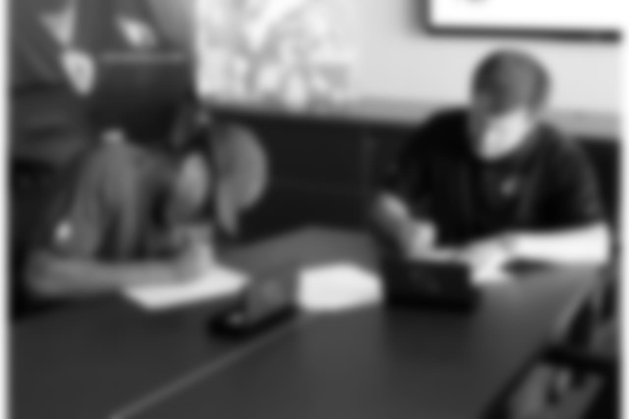 CB Chris Campbell and team president Michael Bidwill fill out the contract