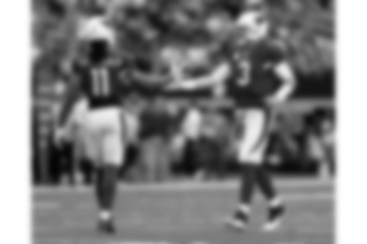 QB Carson Palmer (right) and WR Larry Fitzgerald celebrate during the Cowboys game in 2014