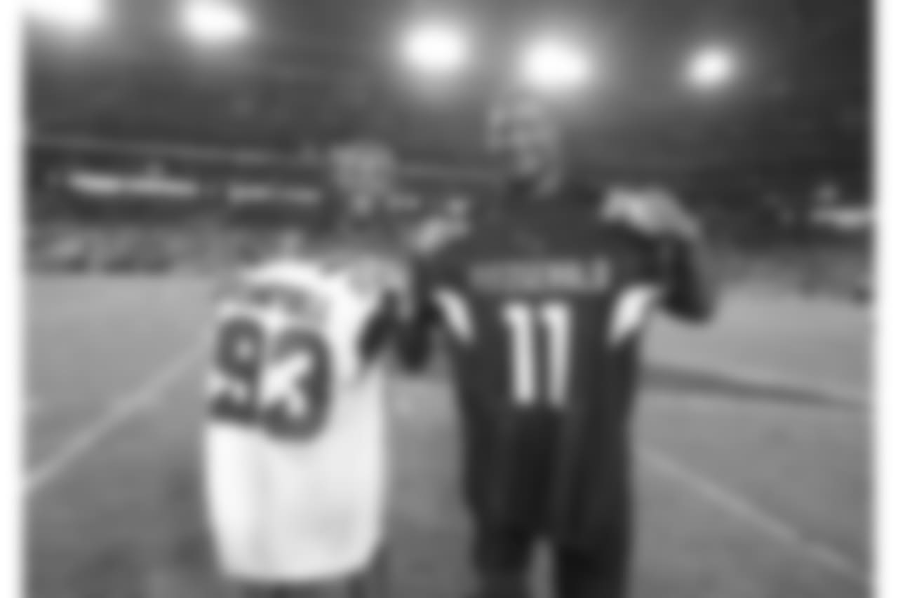 Larry Fitzgerald (left) and Calais Campbell (right) exchange jerseys after the game