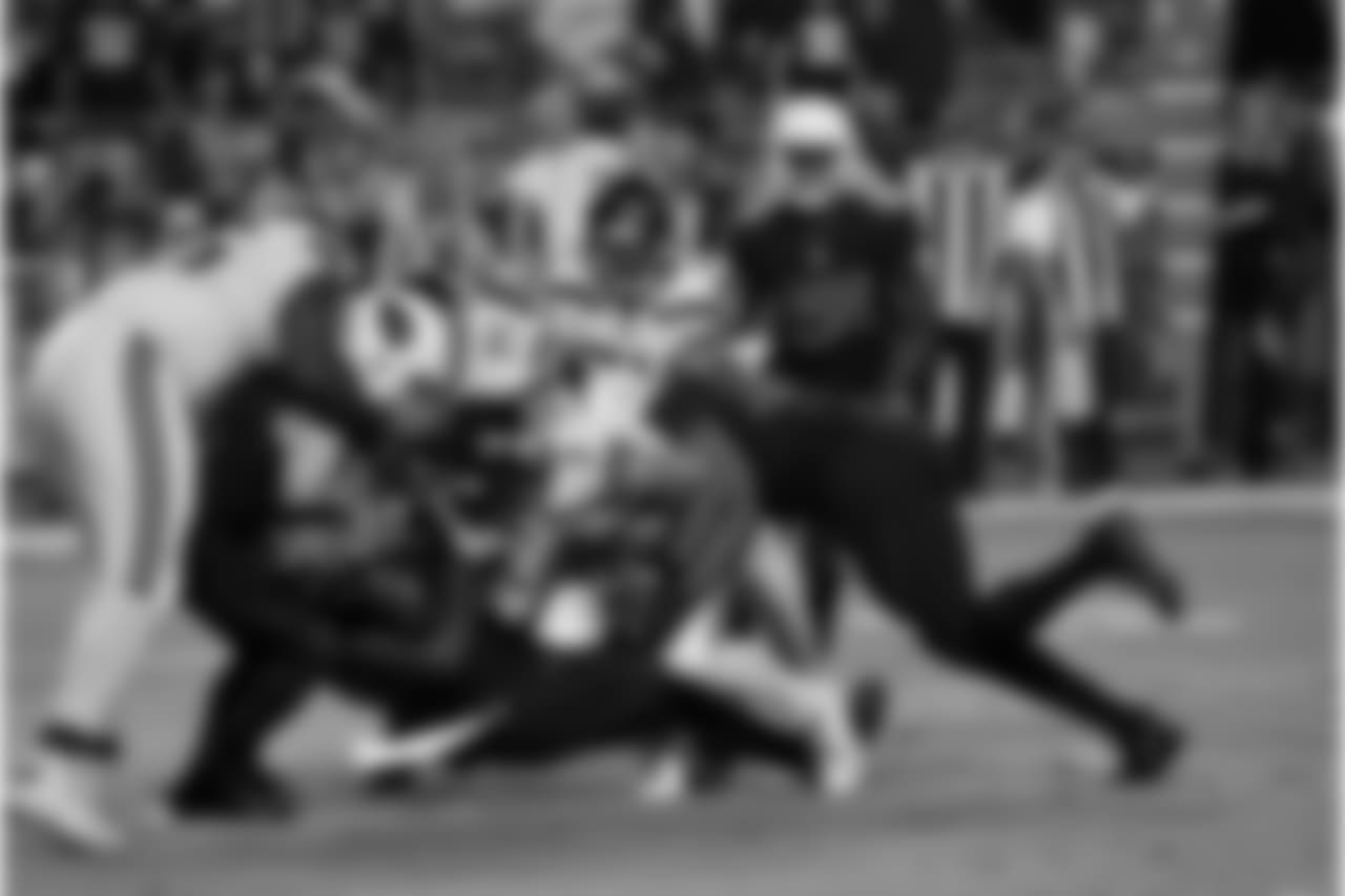 DL Olsen Pierre with a sack