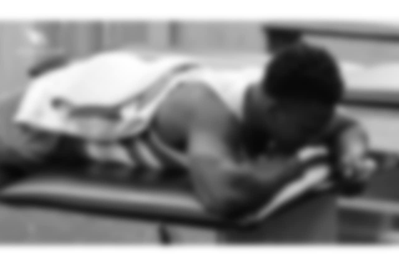 RB Chase Edmonds with a heating pad on his back
