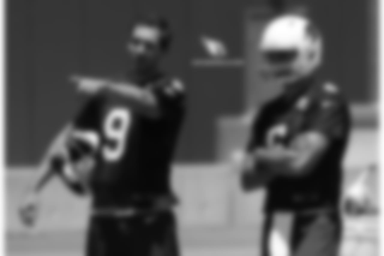 QB Sam Bradford (left) gives advice to QB Chad Kanoff