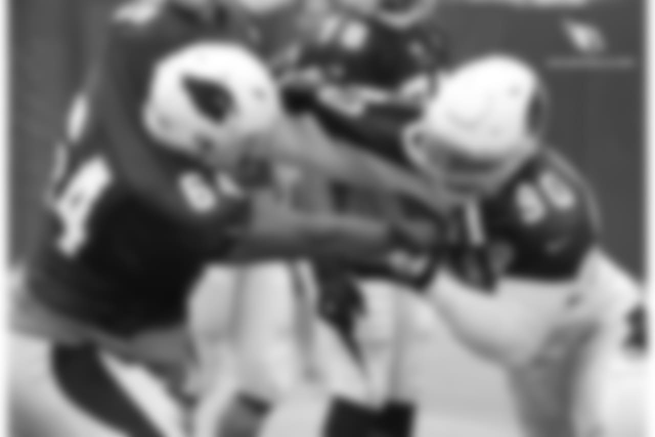 DT Robert Nkemdiche (right) battles G Dorian Johnson in a pass-rush drill