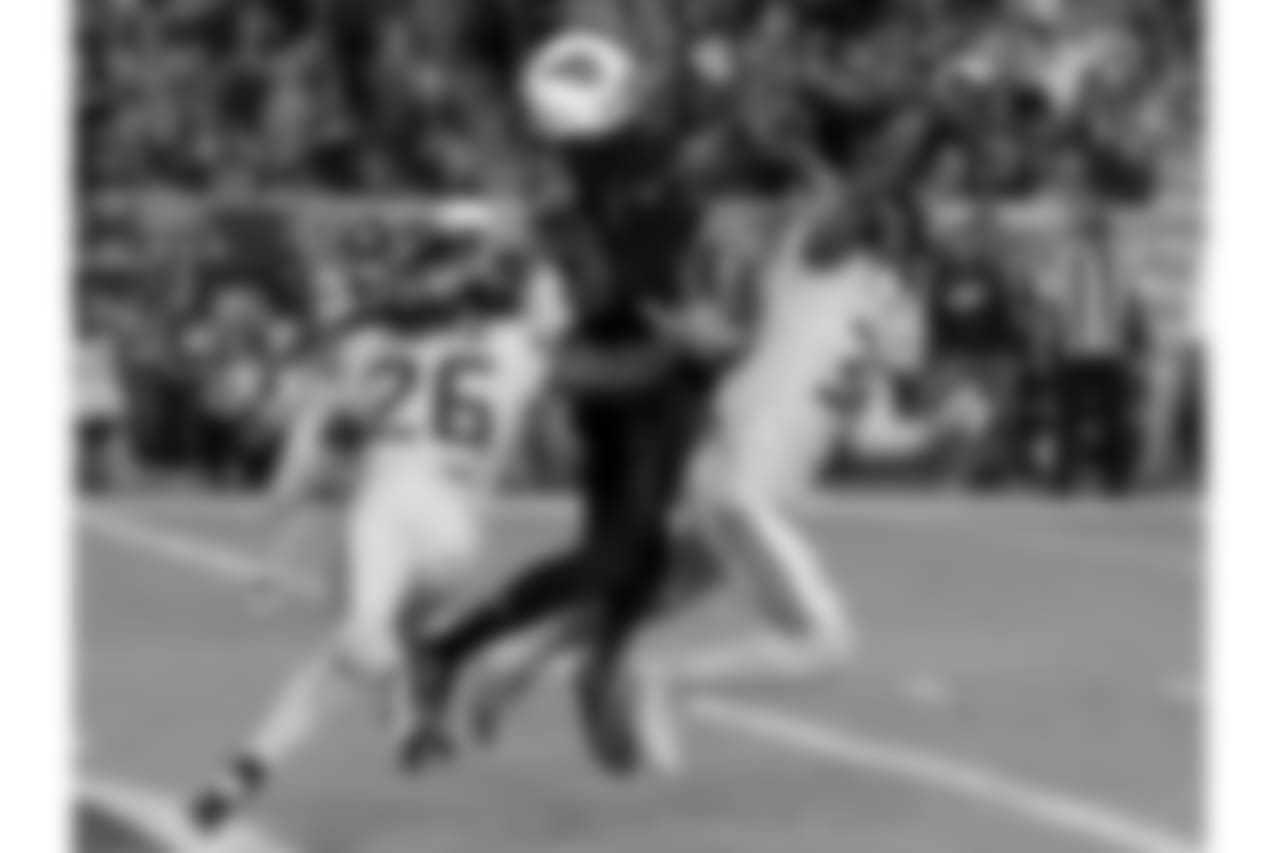 WR Jaron Brown goes up for the catch
