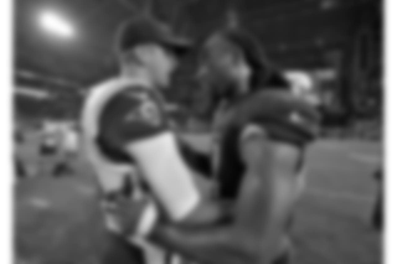 Larry Fitzgerald (right) greets Rams QB Jared Goff after the game