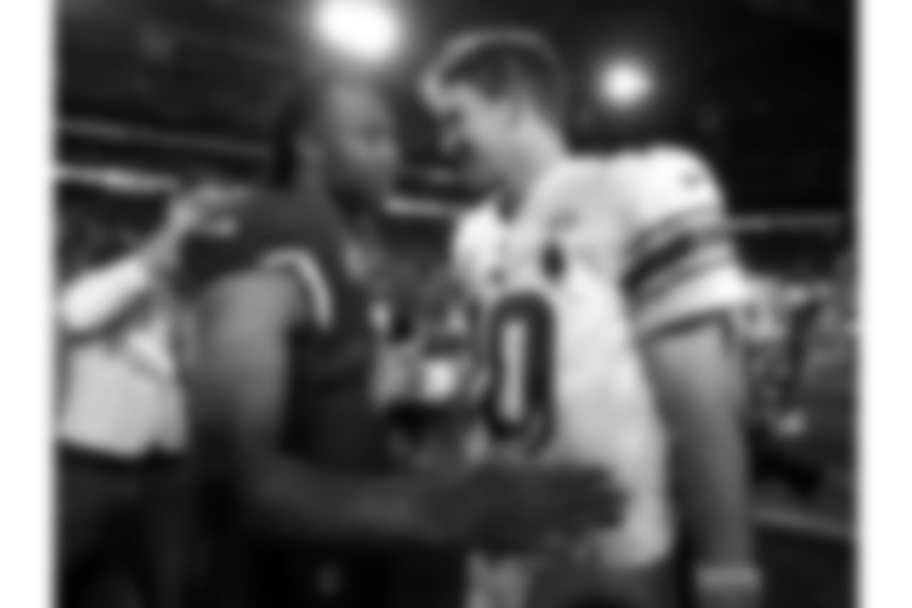 Larry Fitzgerald (left) and Eli Manning (right) meet after the game