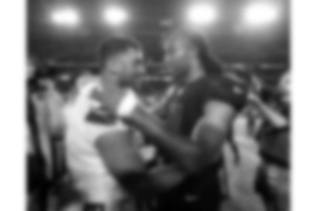 Russell Wilson (left) and Larry Fitzgerald (right) meet after the final whistle