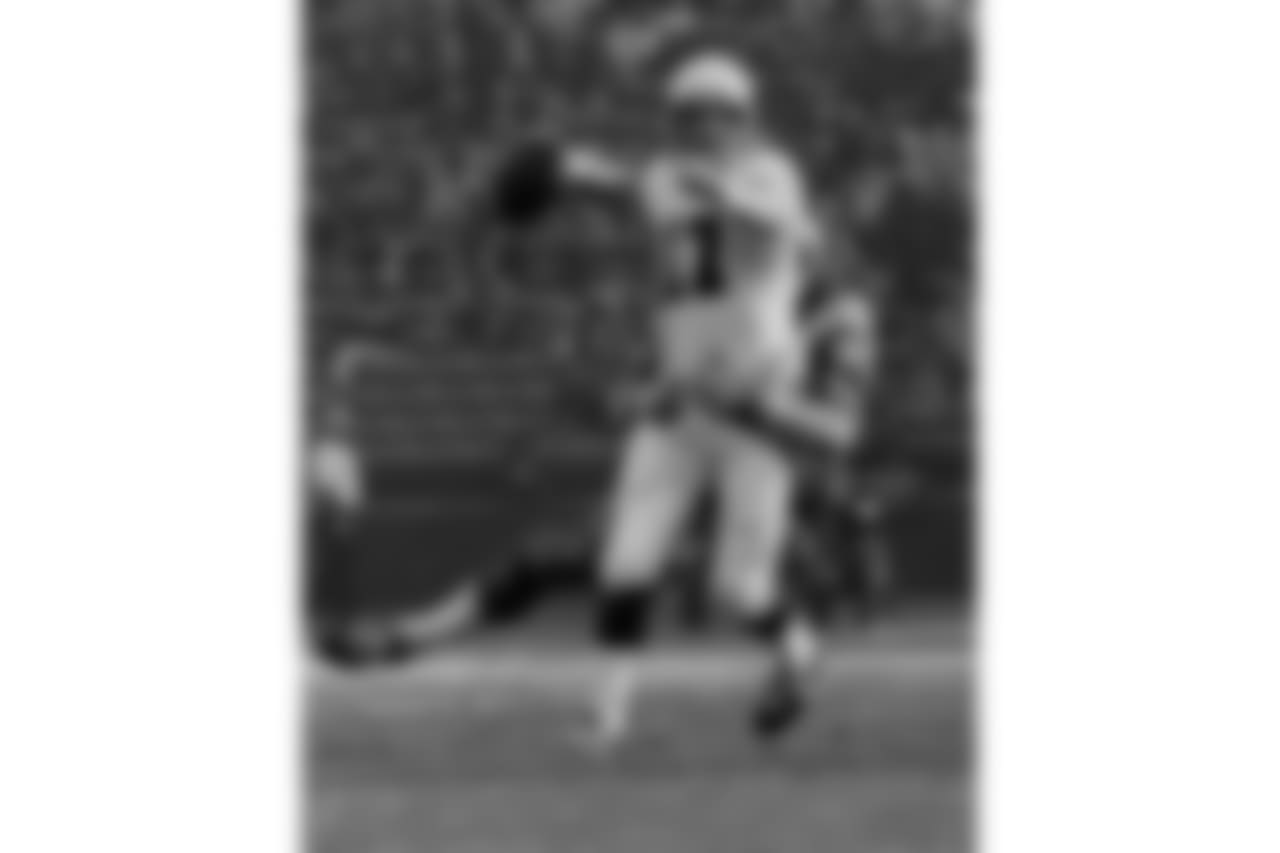 1975: QB Jim Hart winds up as Rams DL Jack Youngblood pursues