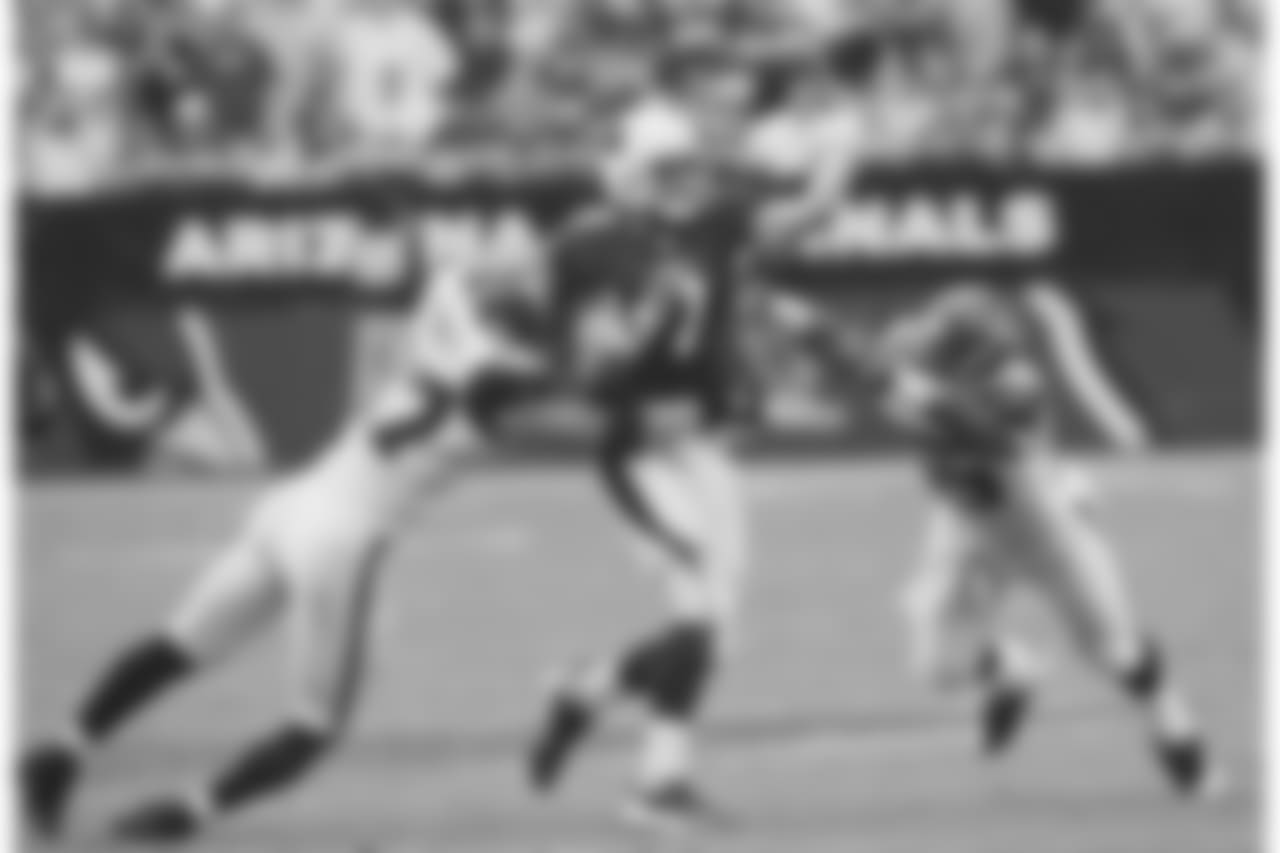2007: QB Matt Leinart is pressured by Seattle's Patrick Kerney and Darryl Tapp