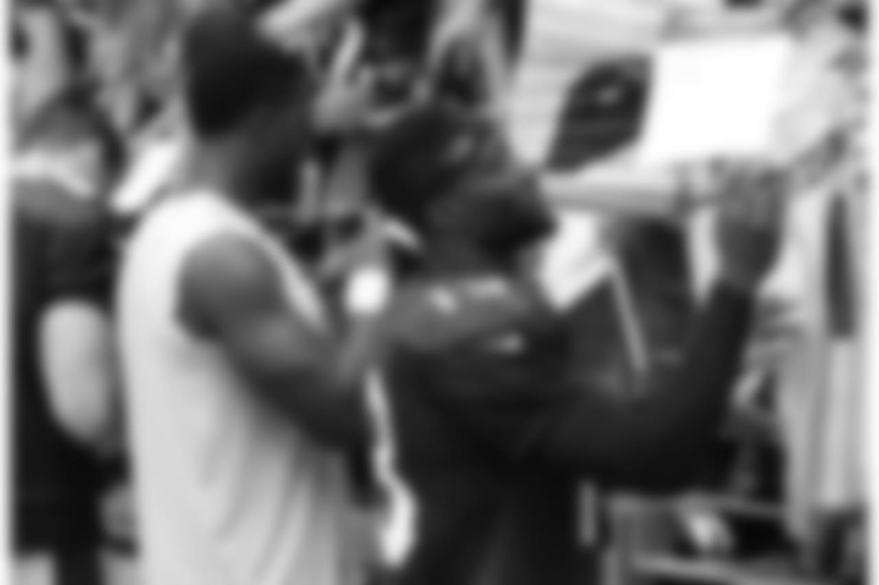 WR Jaron Brown signs an autograph