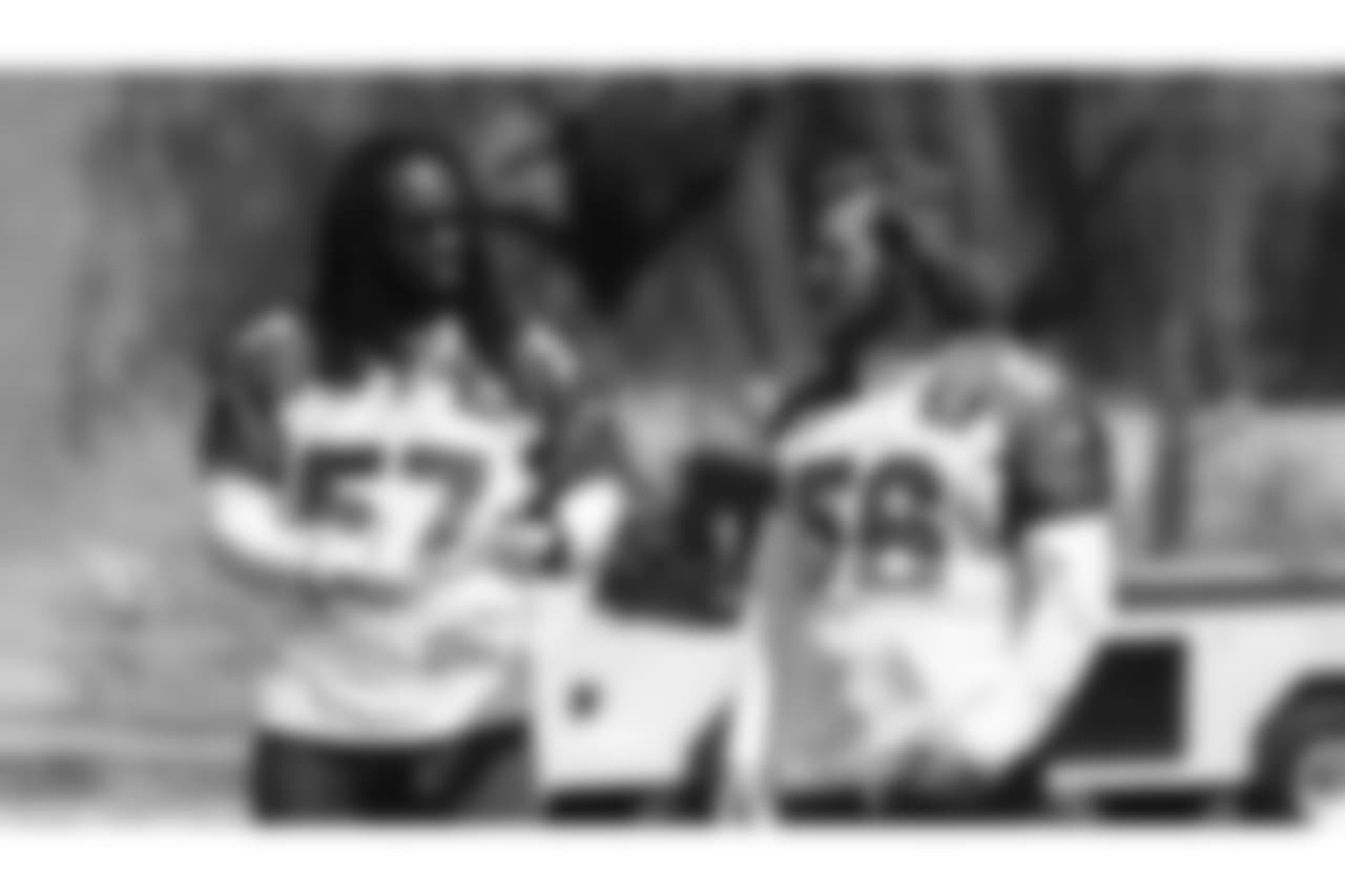 LBs Josh Bynes (57) and Scooby Wright