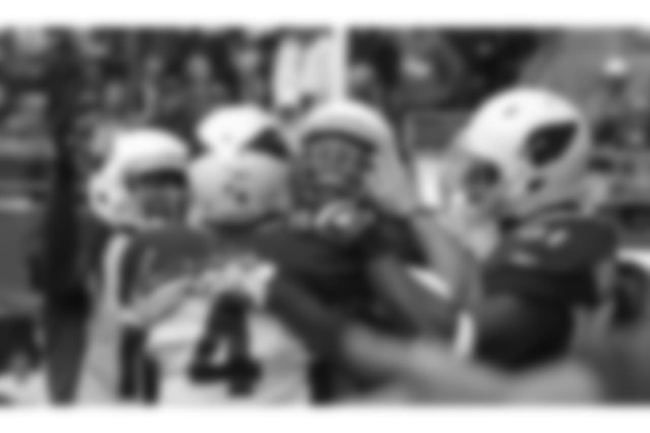 2011: WR Larry Fitzgerald is congratulated after a touchdown