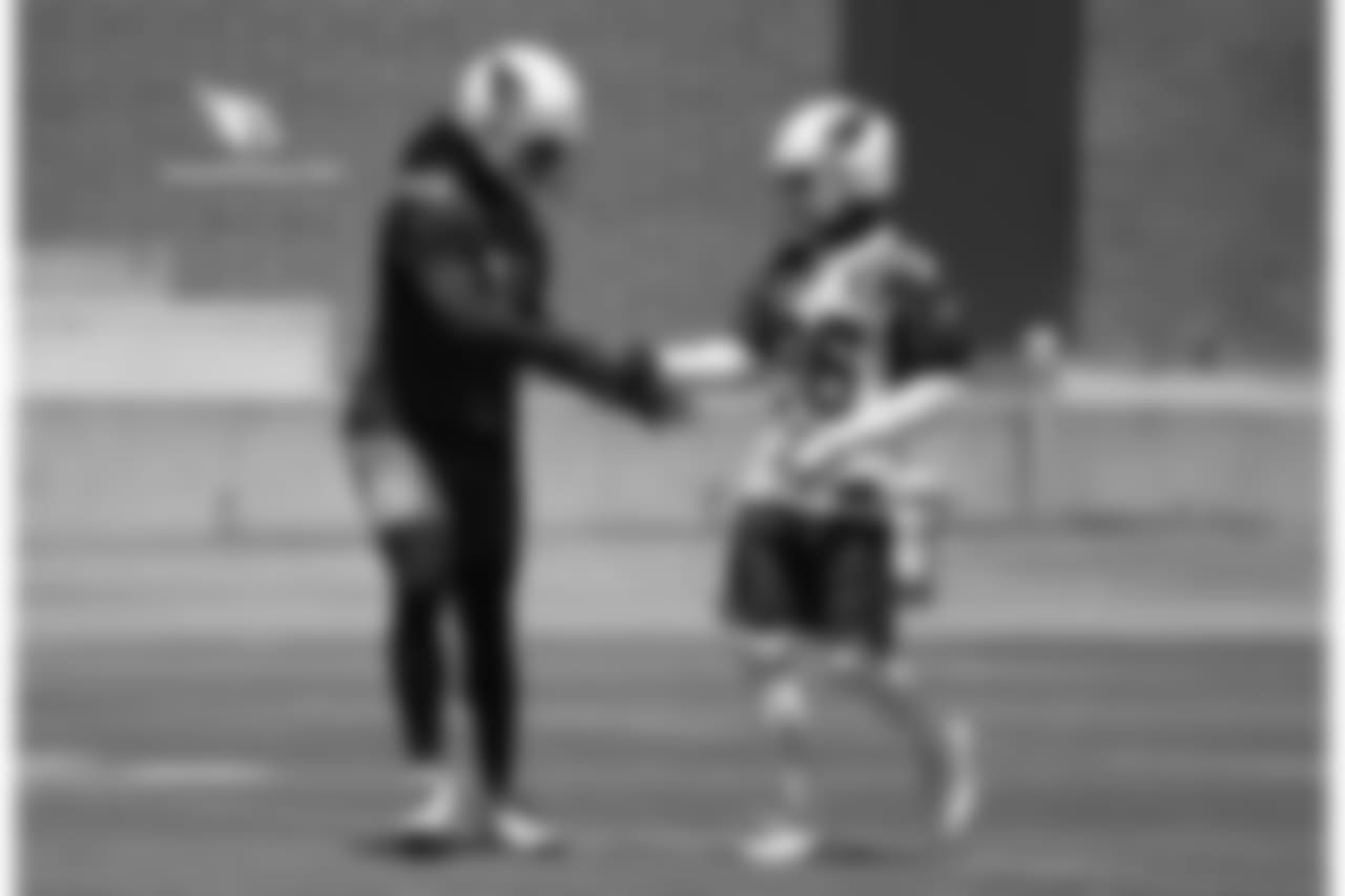 WR Larry Fitzgerald (left) shakes hands with S Budda Baker