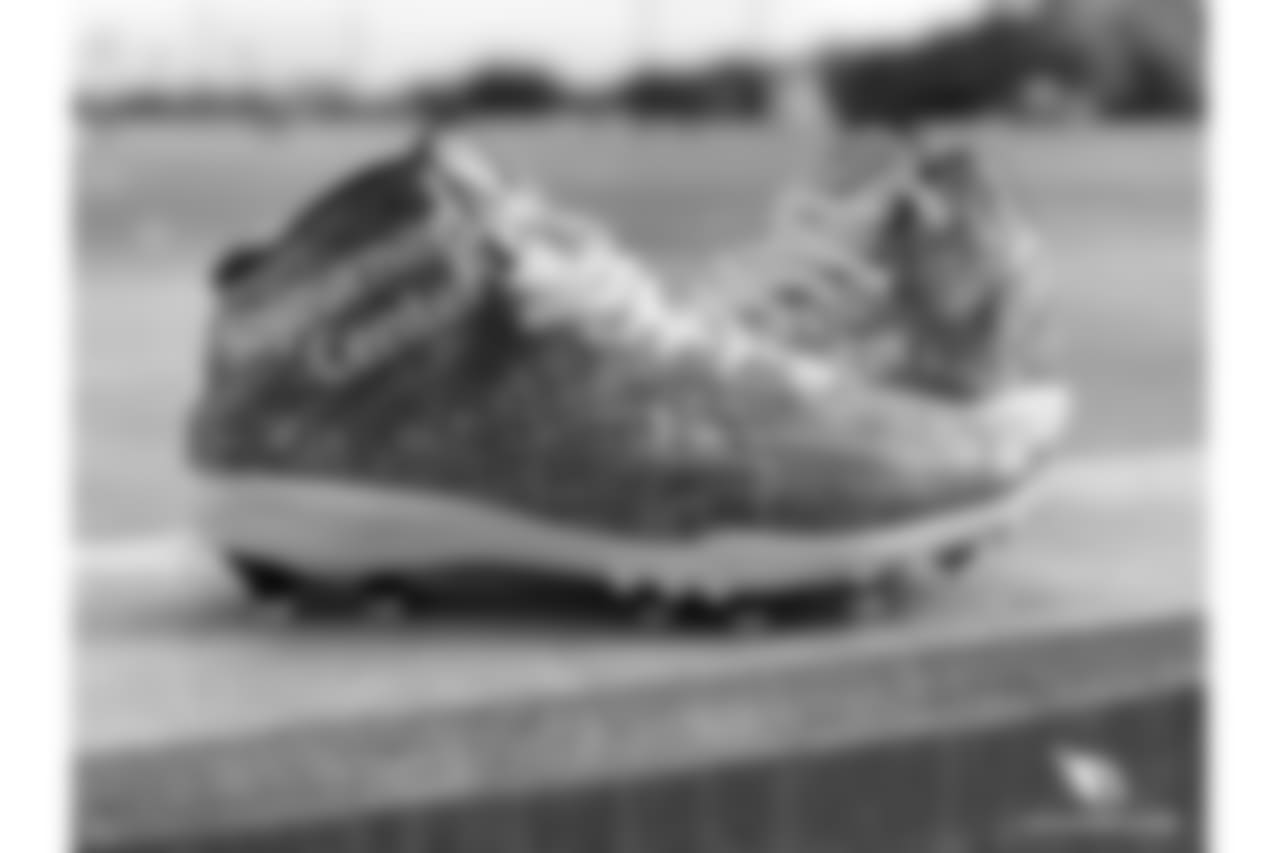 QB Drew Stanton's cause is domestic violence awareness. Children at the Sojourner Center helped design the cleats.