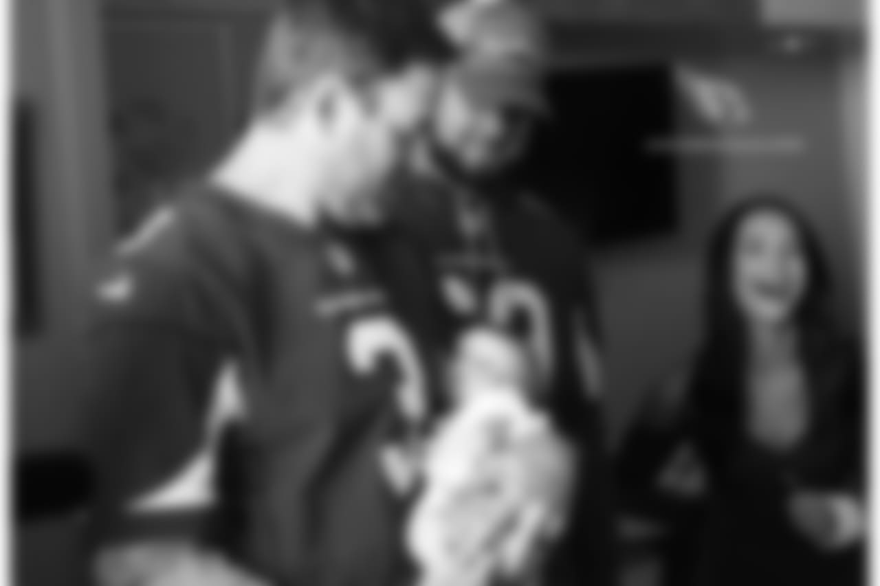 A baby eyes Carson Palmer