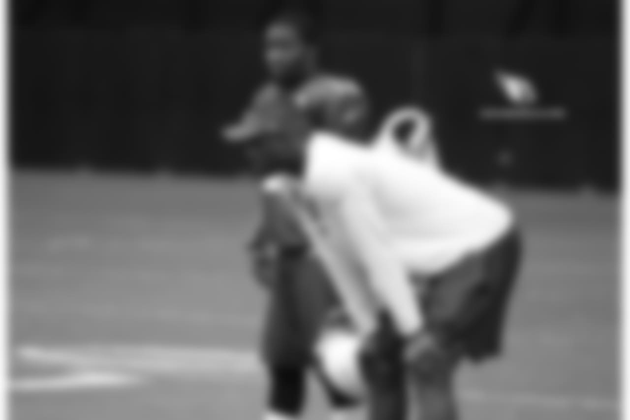 WR John Brown (back) talks to WR coaching intern Plaxico Burress