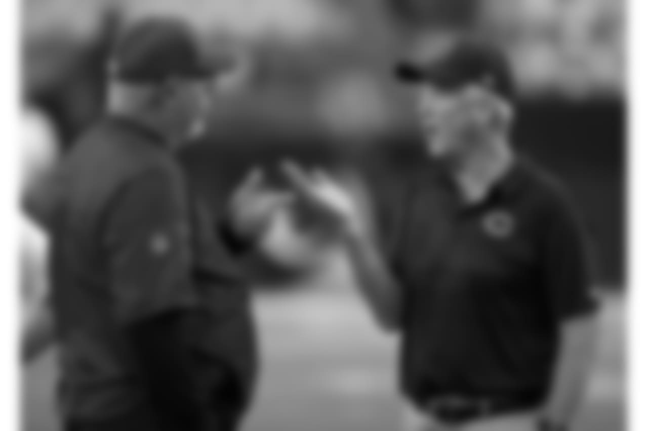Coach Bruce Arians (left) and Bears coach John Fox