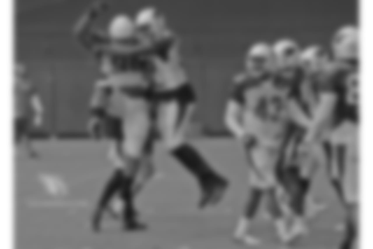 DLs Robert Nkemdiche and Chandler Jones celebrate a big play.